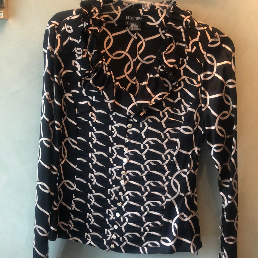 95% silk and spandex blend. Black and champagne!
